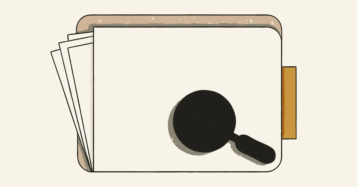 Manila folder with papers peeking out, a magnifying glass resting on it, gold index tab