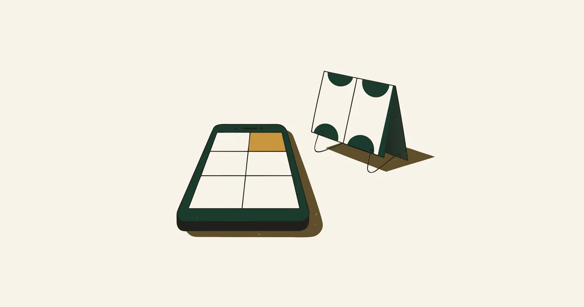 Smartphone showing an empty content grid with one gold tile, beside a desk calendar