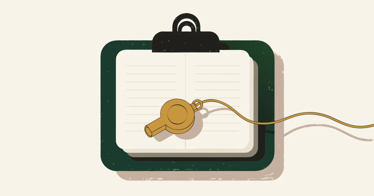 Clipboard with ruled pages and a gold coach whistle on a cord